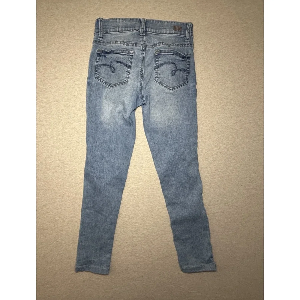 Justice. girl size 10. blue jean with red white and blue side. 4th of july.